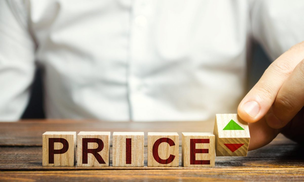 blocks spelling the word price with a green arrow pointing up